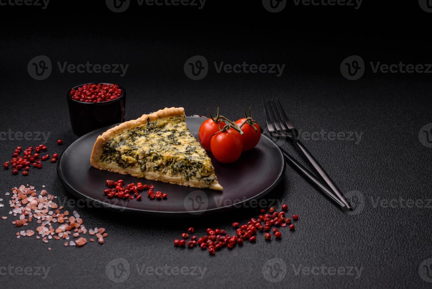 Delicious crispy quiche cut into slices with cheese, broccoli, tomatoes photo