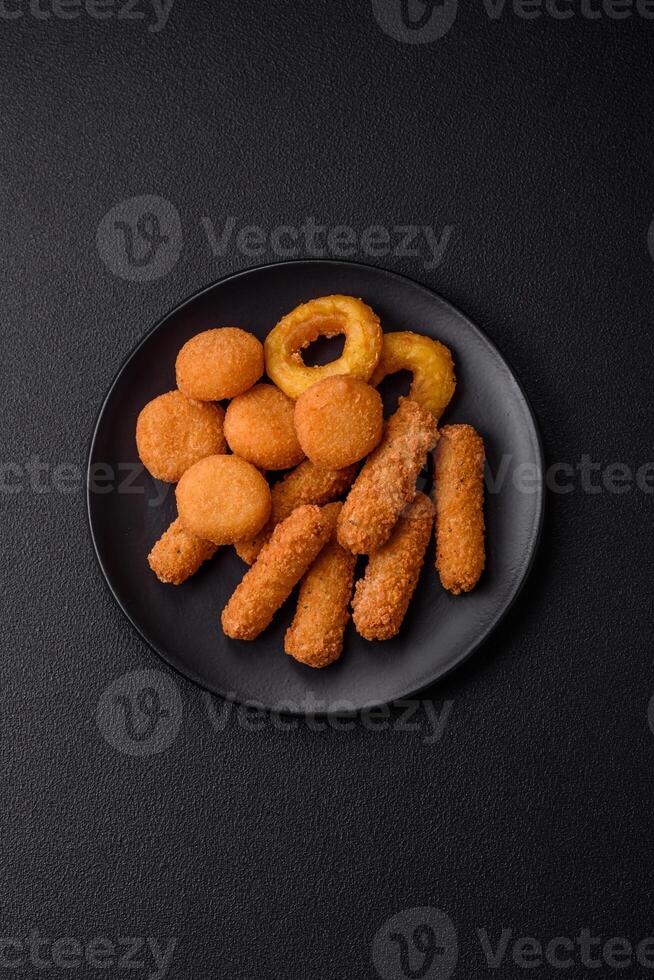 Delicious nuggets, rings and balls of mozzarella and parmesan cheese photo