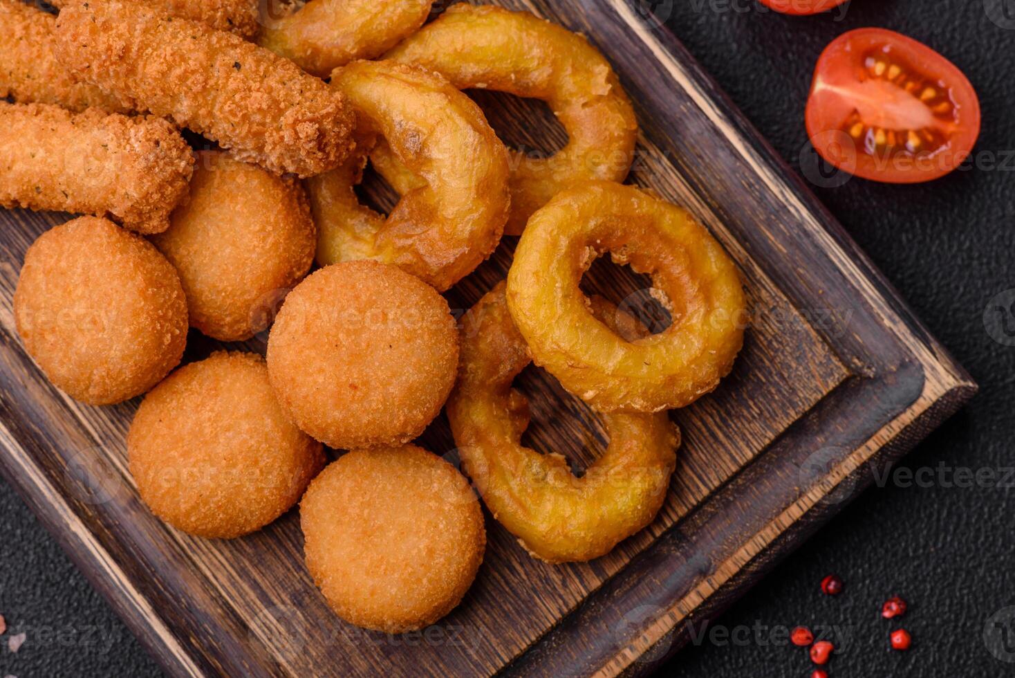 Delicious nuggets, rings and balls of mozzarella and parmesan cheese photo