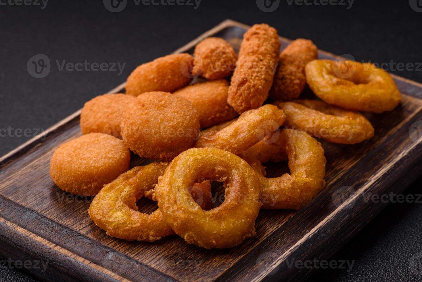 Delicious nuggets, rings and balls of mozzarella and parmesan cheese photo