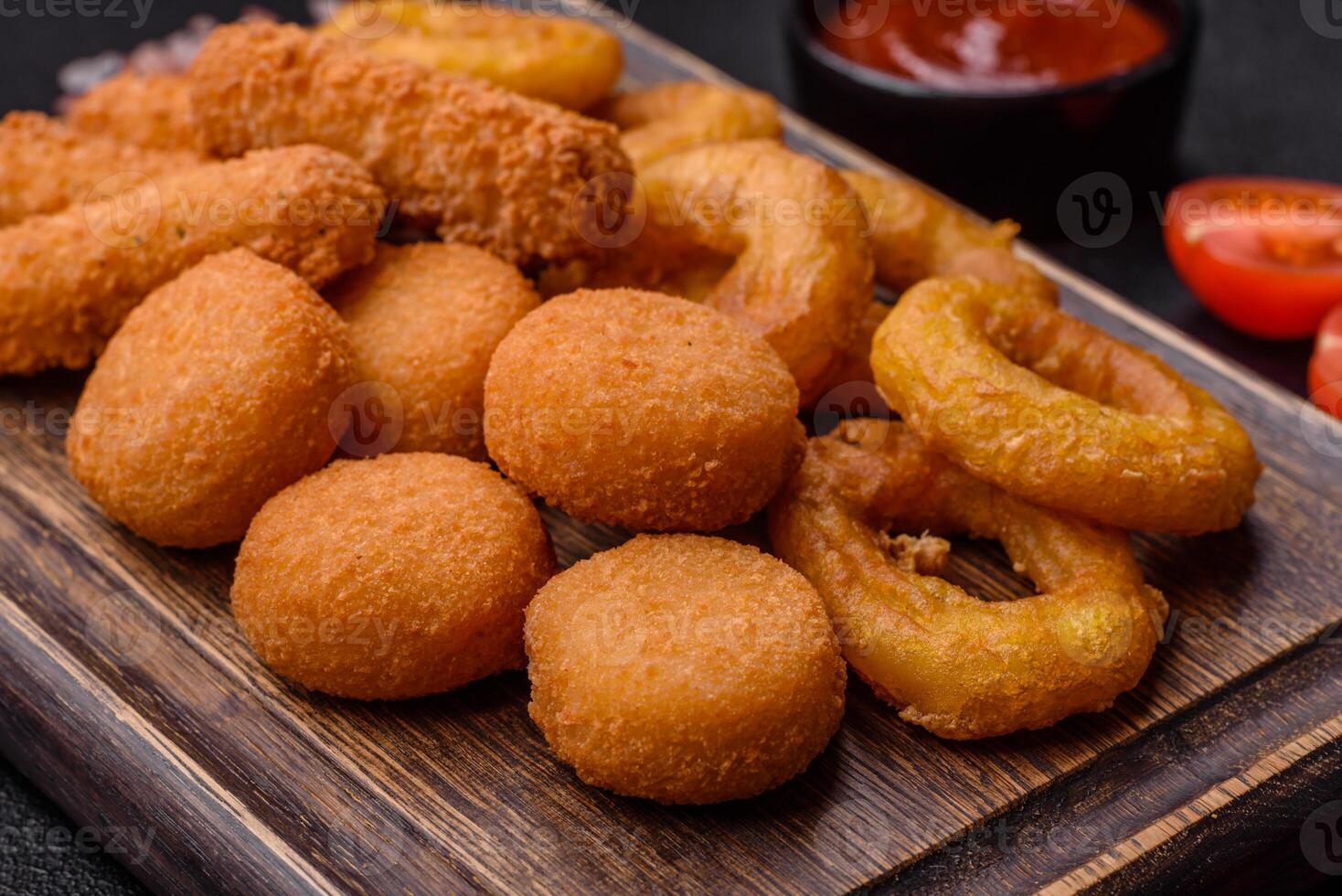 Delicious nuggets, rings and balls of mozzarella and parmesan cheese photo