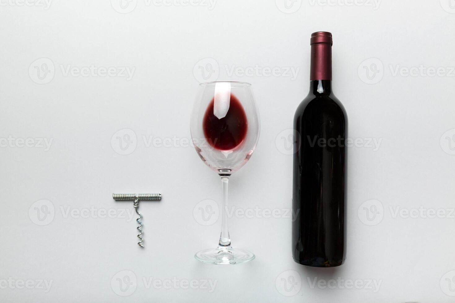 Flat lay composition with corkscrew, bottle of wine and elegant glass on colored table. Flat lay, top view wth copy space photo