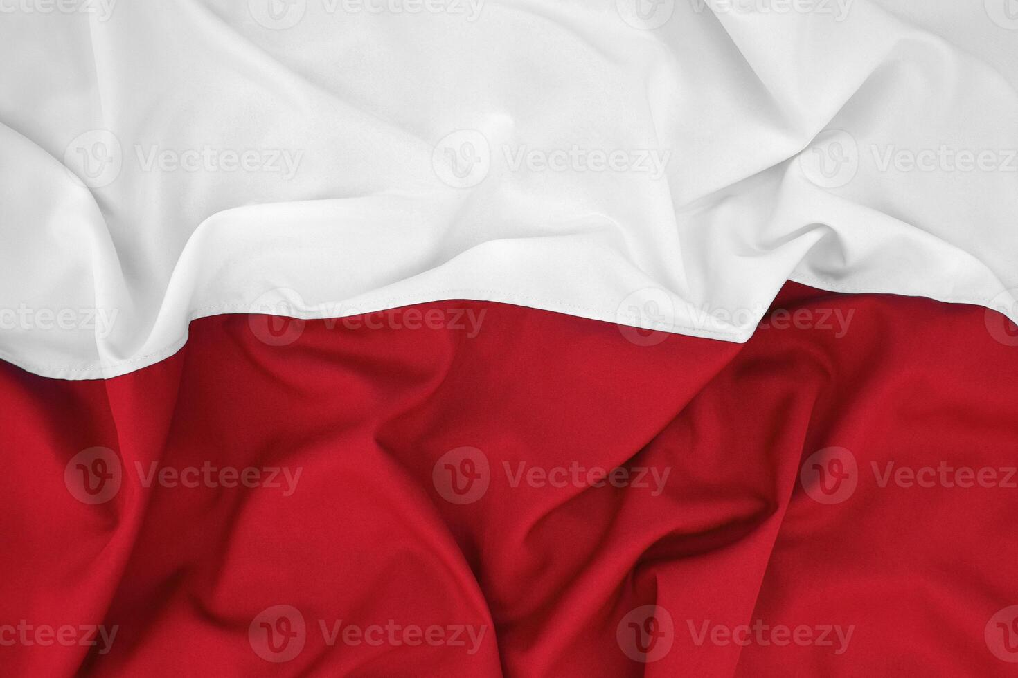 Fabric bent national flag of Poland, European. photo