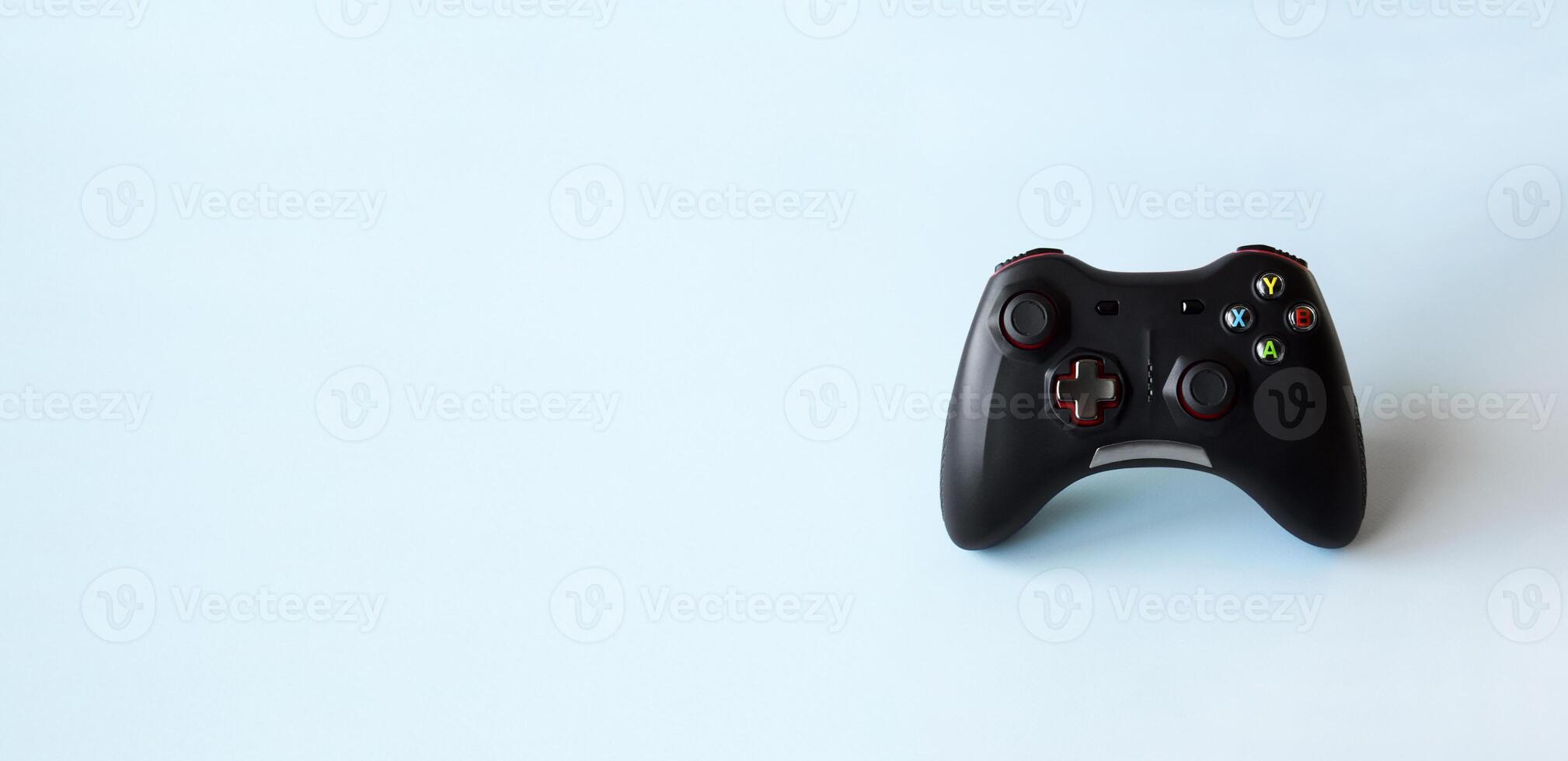 Two joystick gaming controller on light blue background. Minimalism. photo