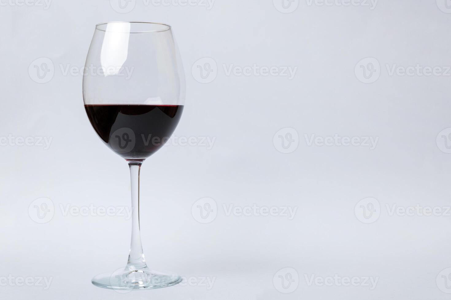 One glasses of red wine at wine tasting. Concept of red wine on colored background. Top view, flat lay design photo