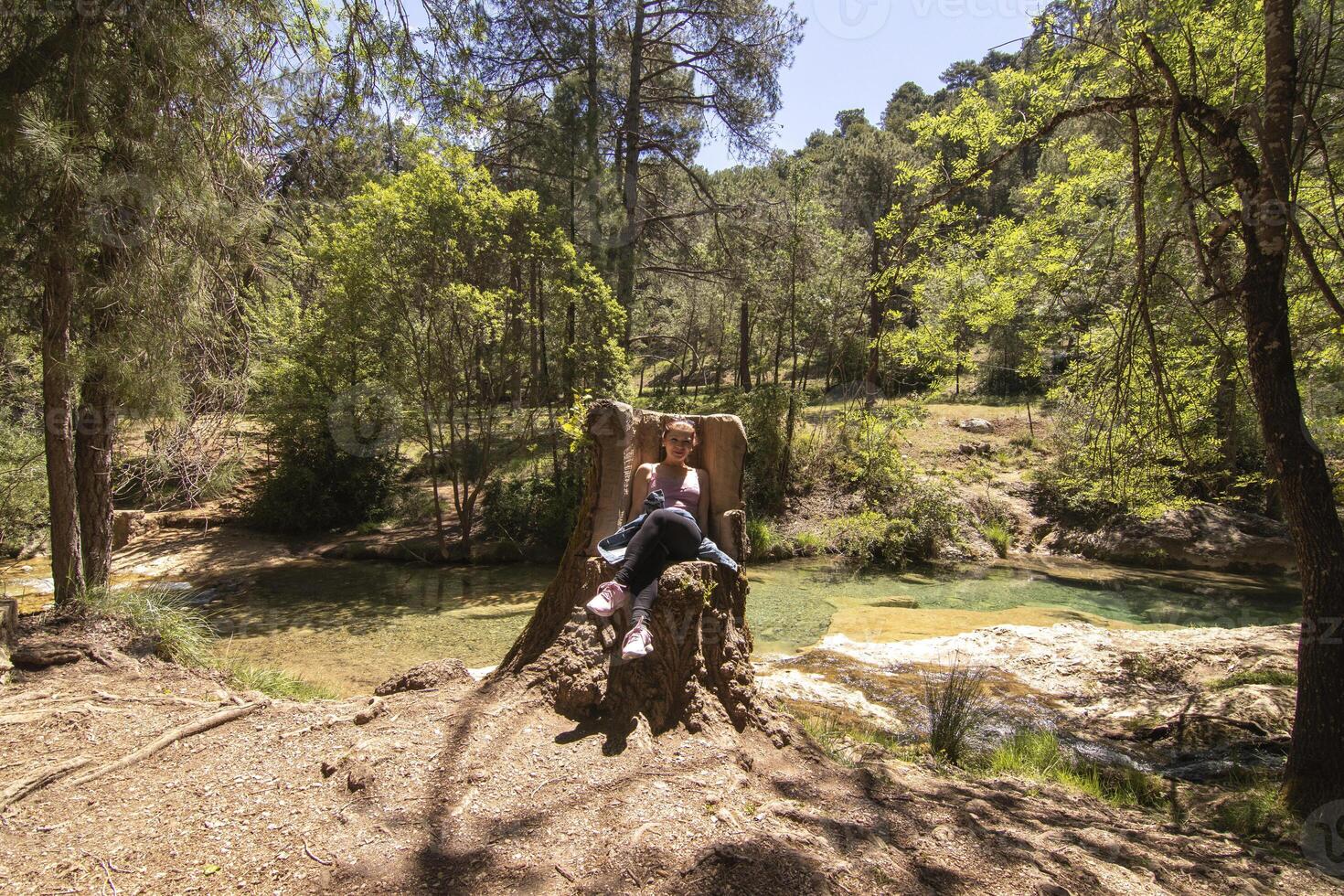 Caucasian mature woman hiking through the beautiful nature of the Sierra de Cazorla, Jaen, Spain. photo