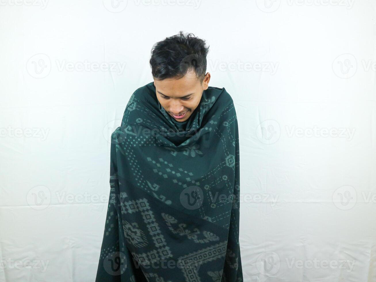 gestures and expressions of cold men wrapped in blankets photo