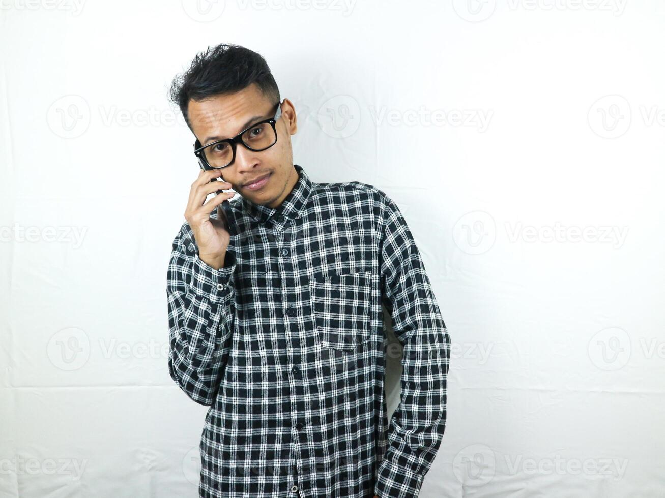 Portrait of asian man talking on phone with smiling face expression. photo