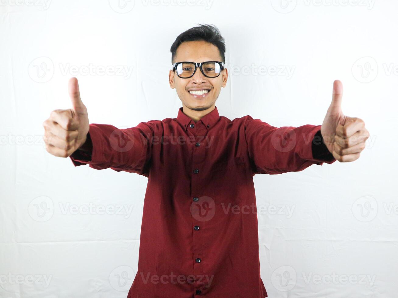 Asian man showing okay gesture isolated on white background. Agreement, approval. OK, Thumps up photo