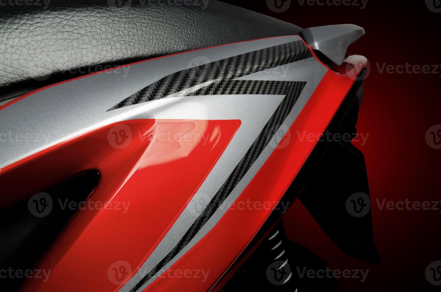 a rear body of a red scooter type motorbike. photo