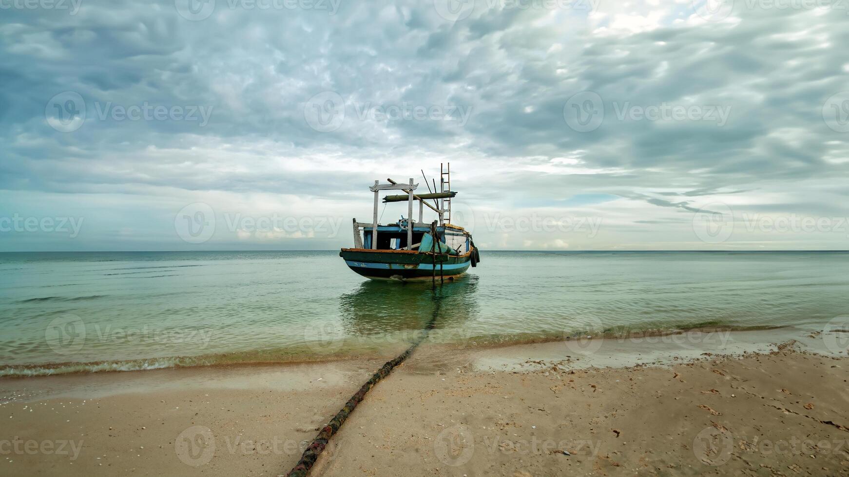 A traditional passenger ship is on the coast of Gili Island, Indonesia photo