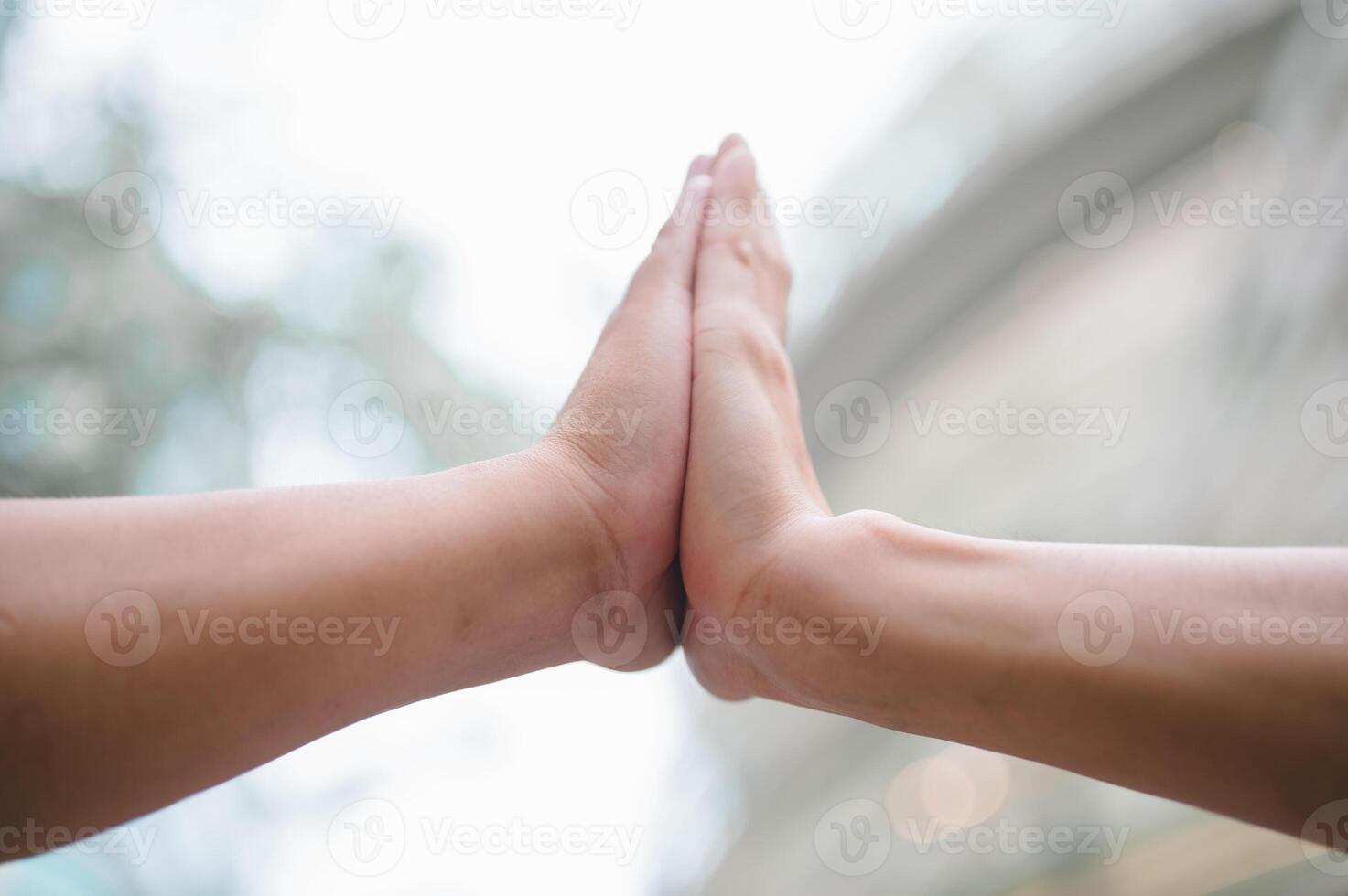 hands hi5 while standing outside of the office at City, Business Colleagues hitting hands photo