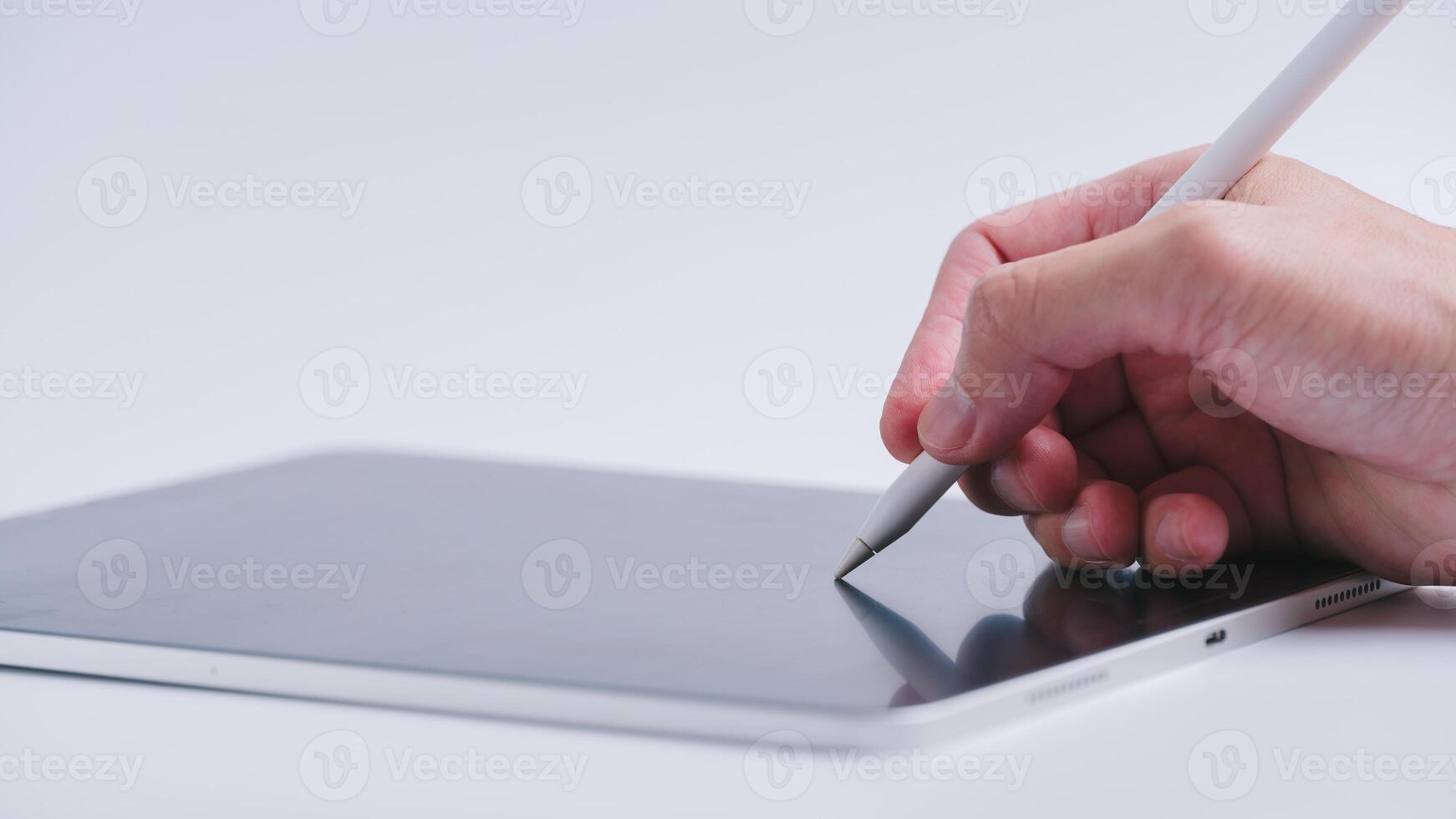 businessman hand using pen writing on digital tablet in concept of digital transformation technology internet of thing photo