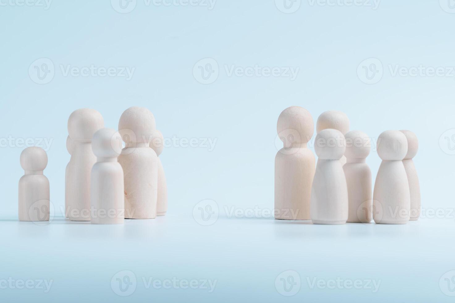 two group of wood dolls in concept of teamwork conflict resolution and negotiation in business photo