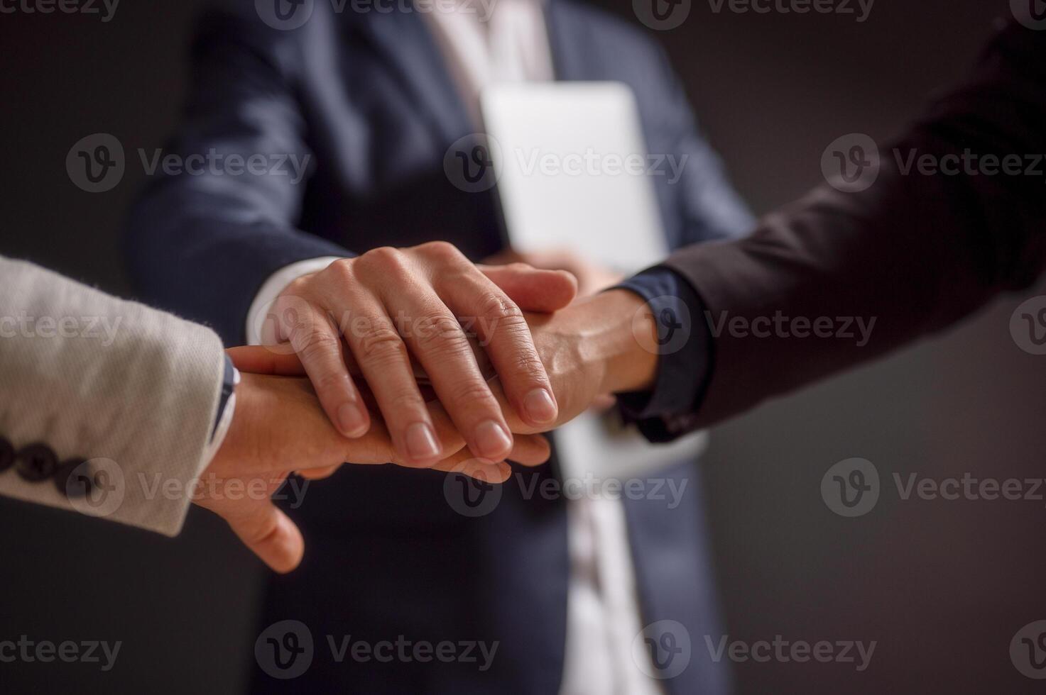 business people putting their hands together. Stack of hands. Unity and teamwork concept photo