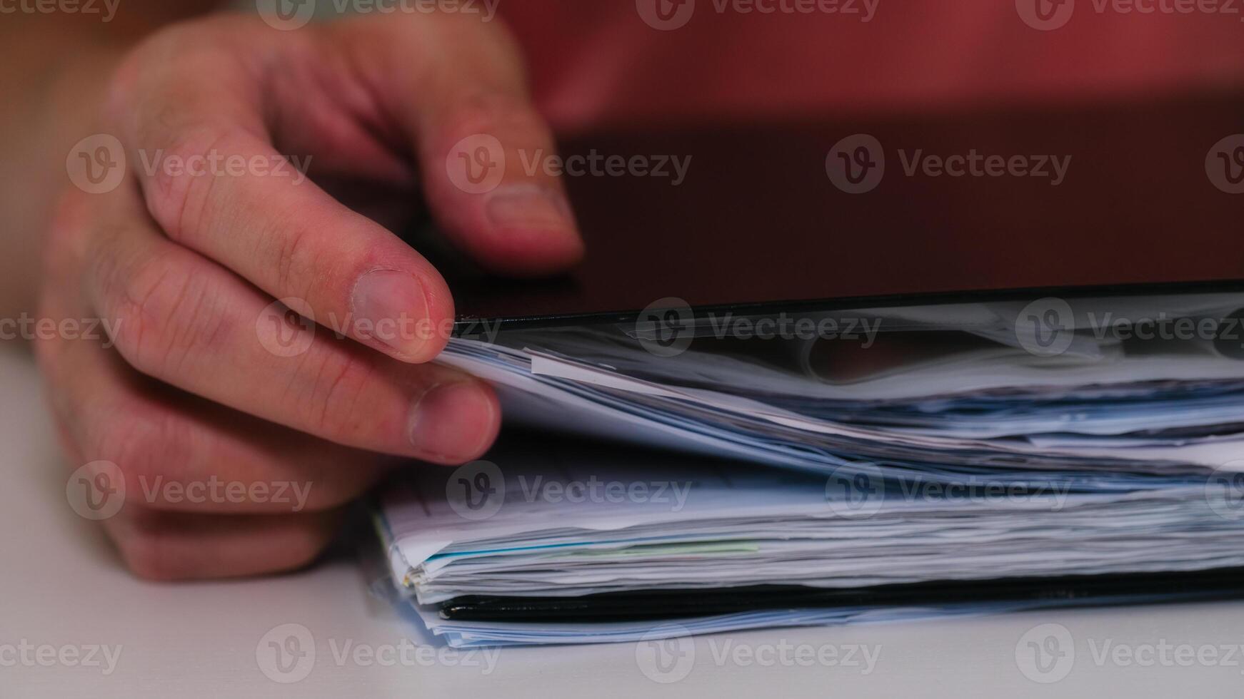 businessman hand working with a document folder in concept of document management system photo