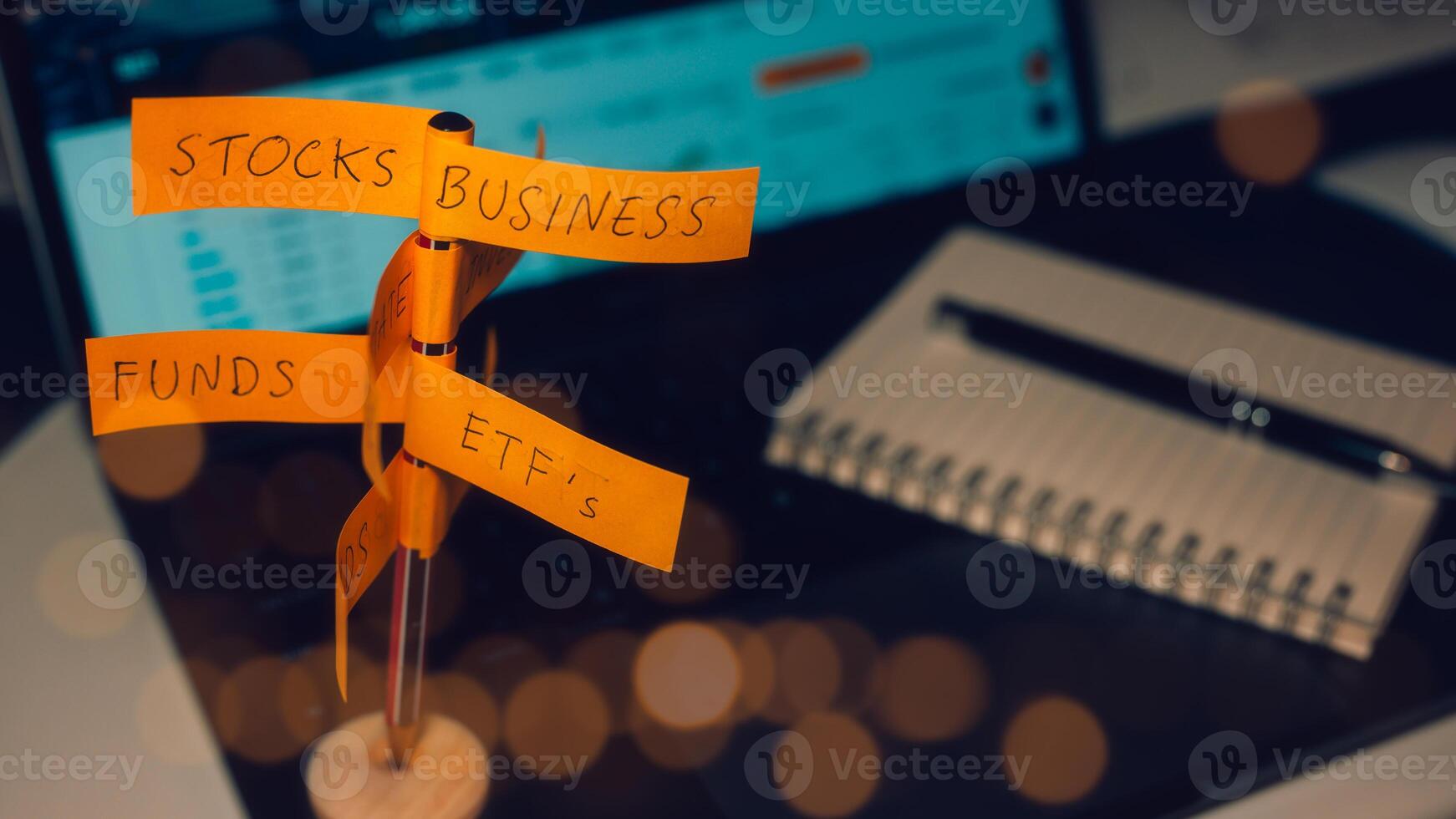 Financial Investments and asset allocation concept. direction sign with investment options on blurred office computer background photo
