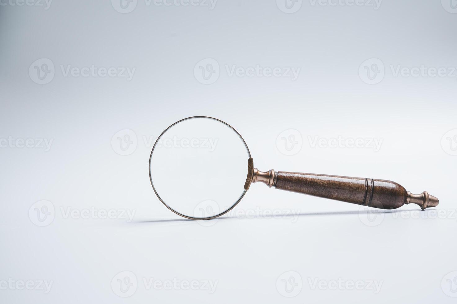 Wood Handle Magnifying Glass Isolated on White background photo