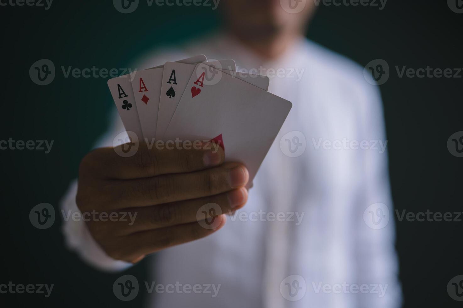 Aces in poker player hand in concept of casino gambling photo