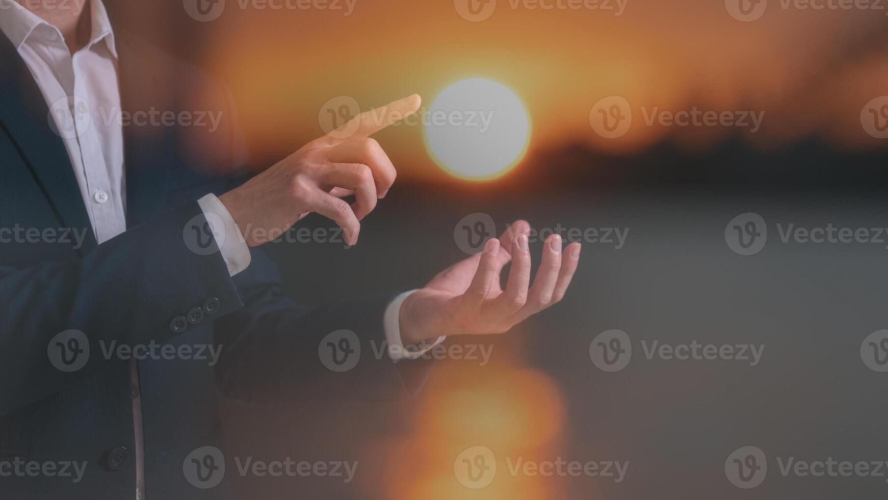 hope concept multi exposure businessman hold and poiting to the sun in golden hours photo