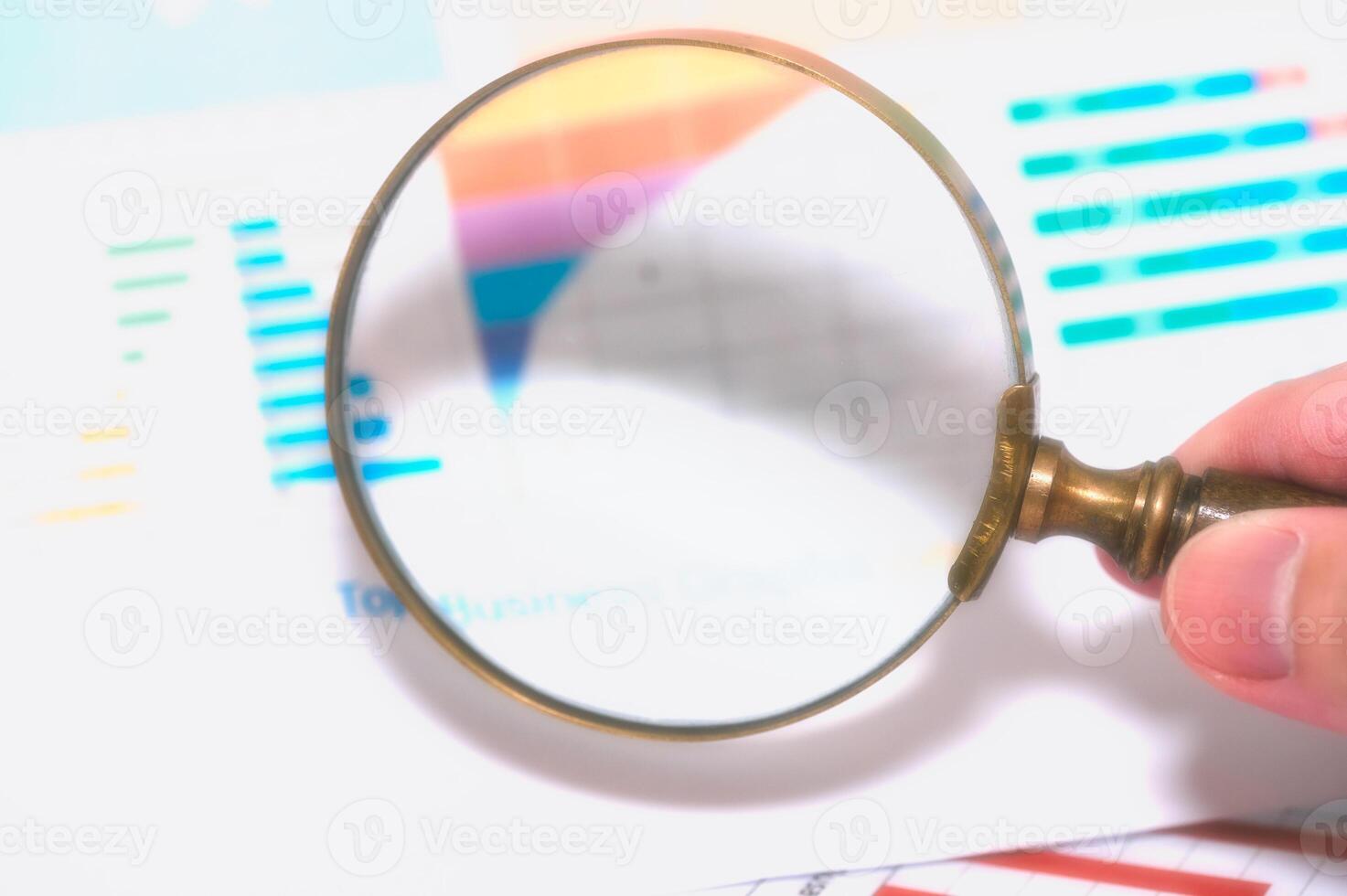 Magnifying glass on graph paper. Financial development, Banking Account, Statistics, Investment Analytic research data economy, Business concept photo