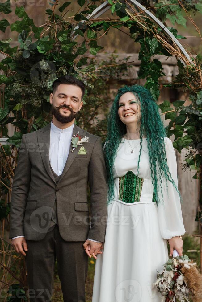 wedding ceremony of the newlyweds in a country cottage photo