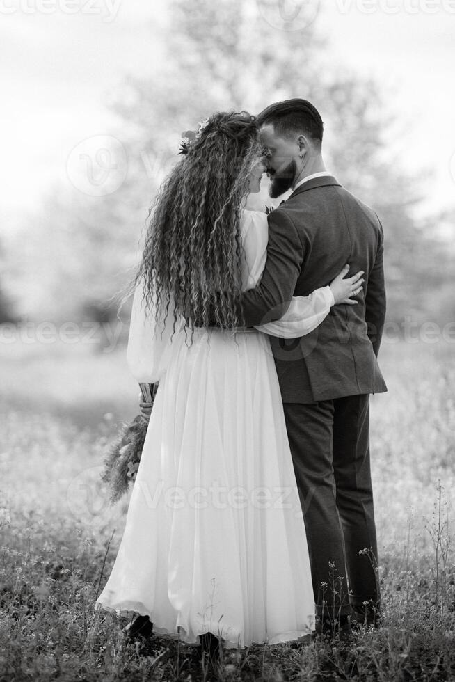 a bearded groom and a girl with green hair are walking photo