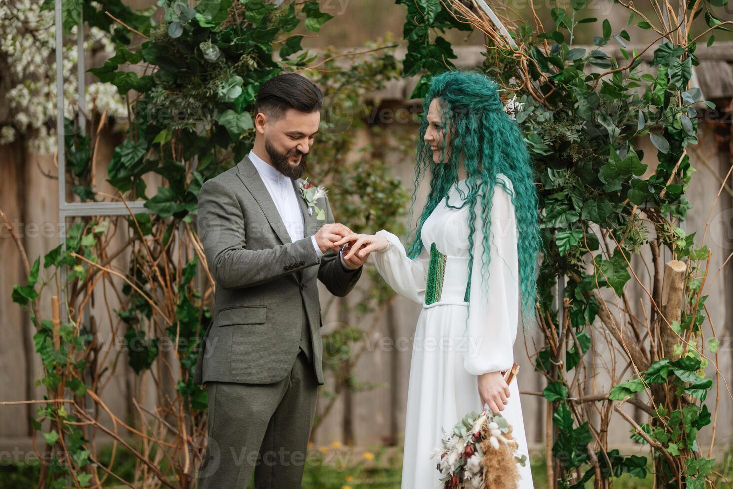 wedding ceremony of the newlyweds in a country cottage photo