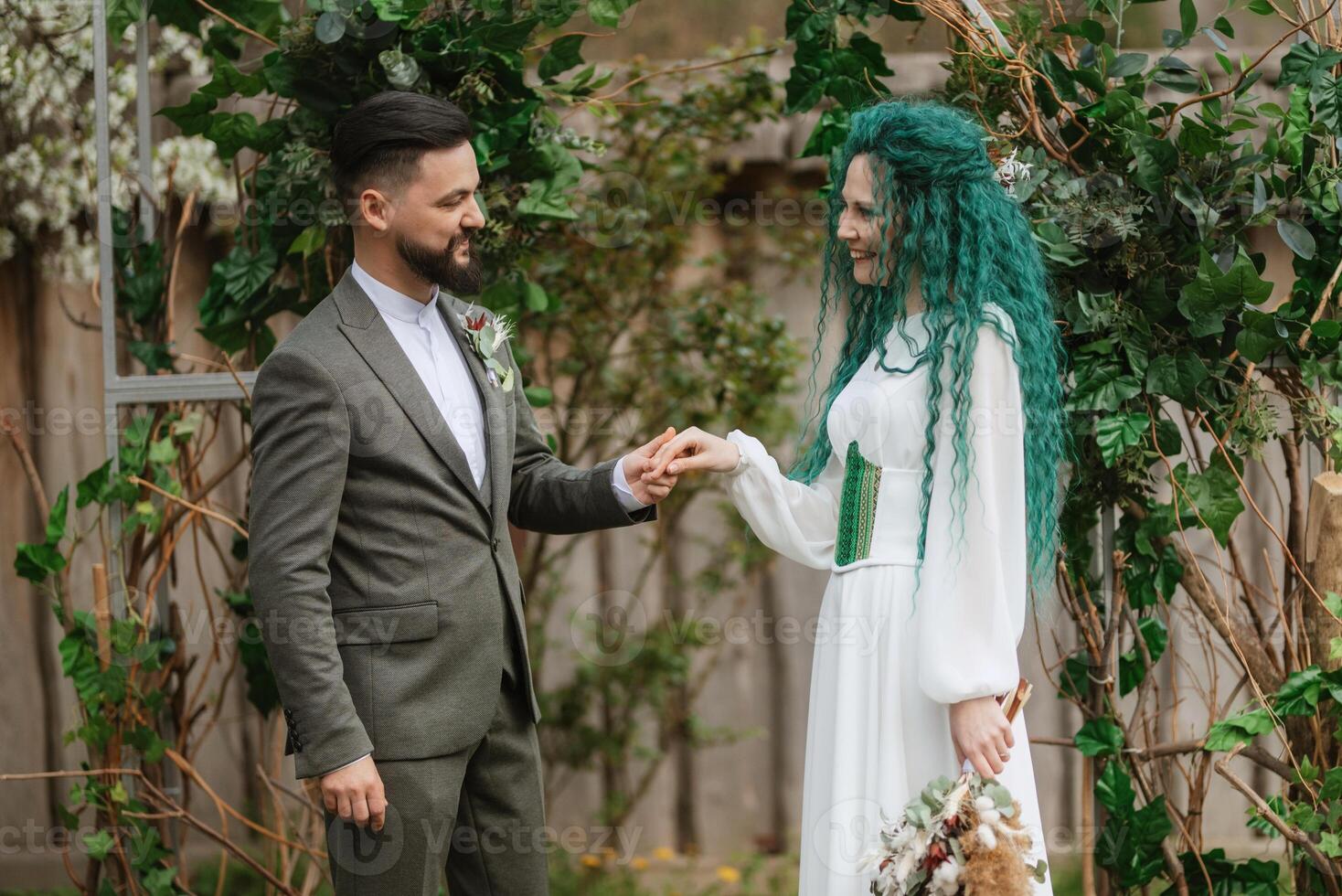 wedding ceremony of the newlyweds in a country cottage photo