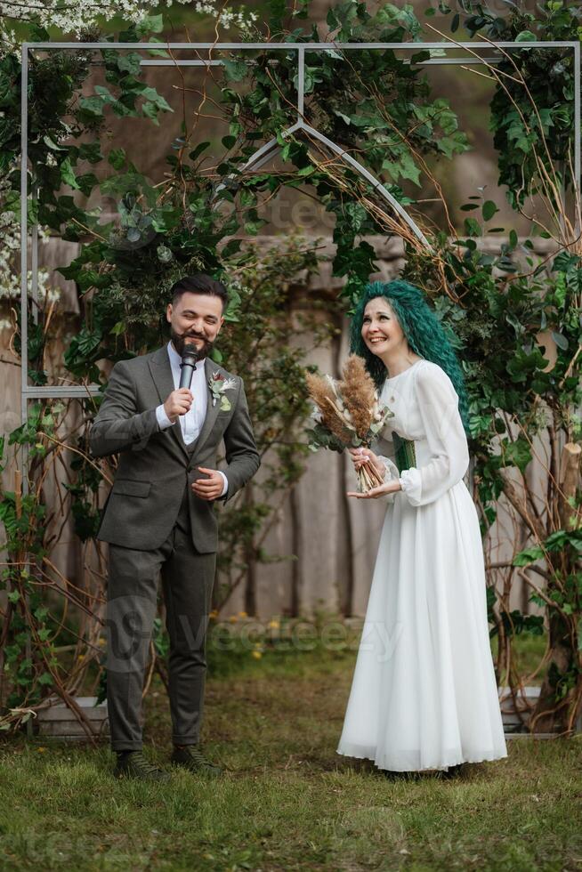 wedding ceremony of the newlyweds in a country cottage photo