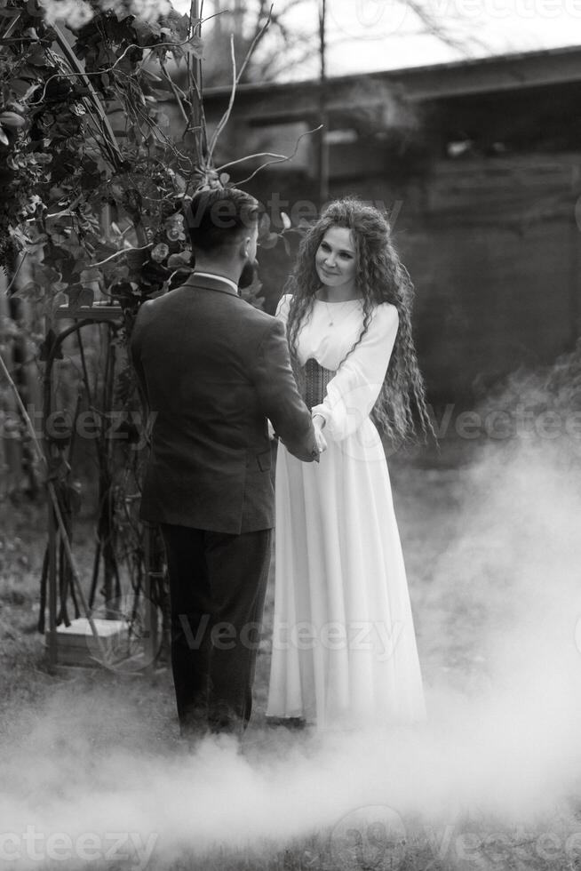 the first wedding dance of the bride and groom in the glade photo