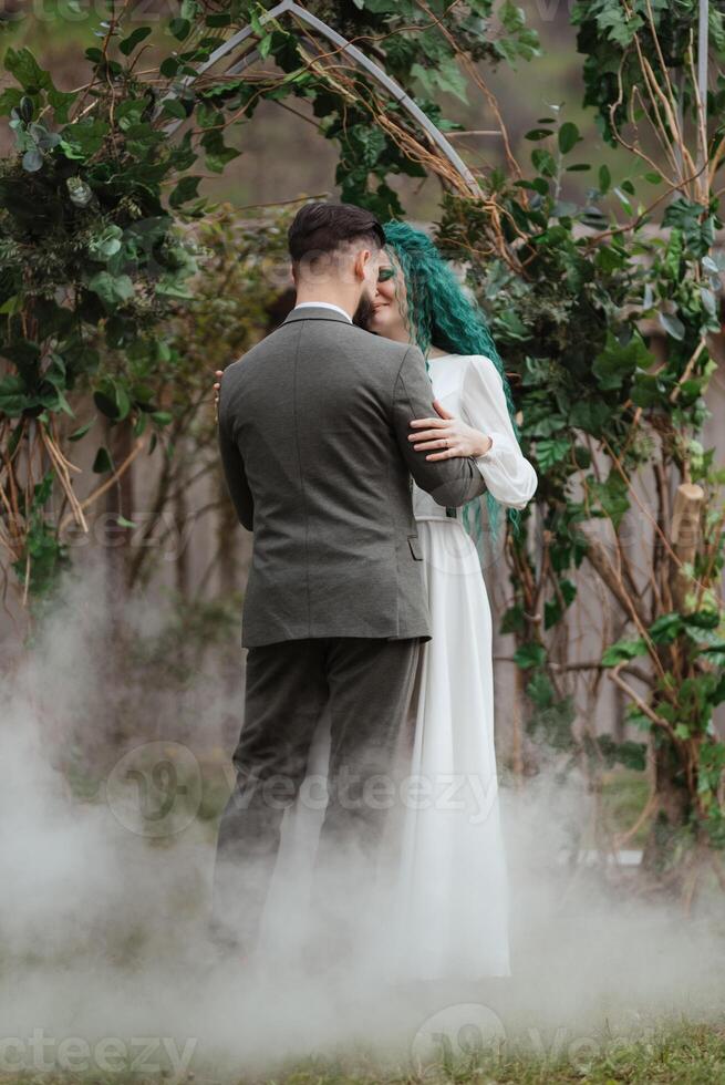 the first wedding dance of the bride and groom in the glade photo