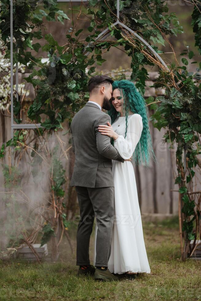 the first wedding dance of the bride and groom in the glade photo