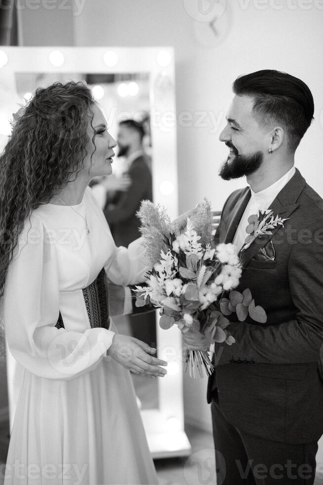 meeting of the bride and groom in the hotel photo