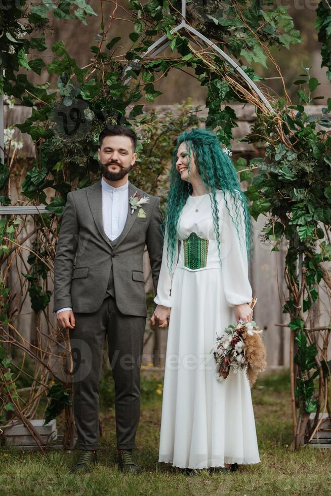 wedding ceremony of the newlyweds in a country cottage photo