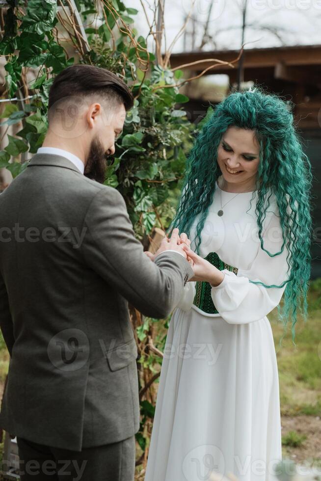 wedding ceremony of the newlyweds in a country cottage photo