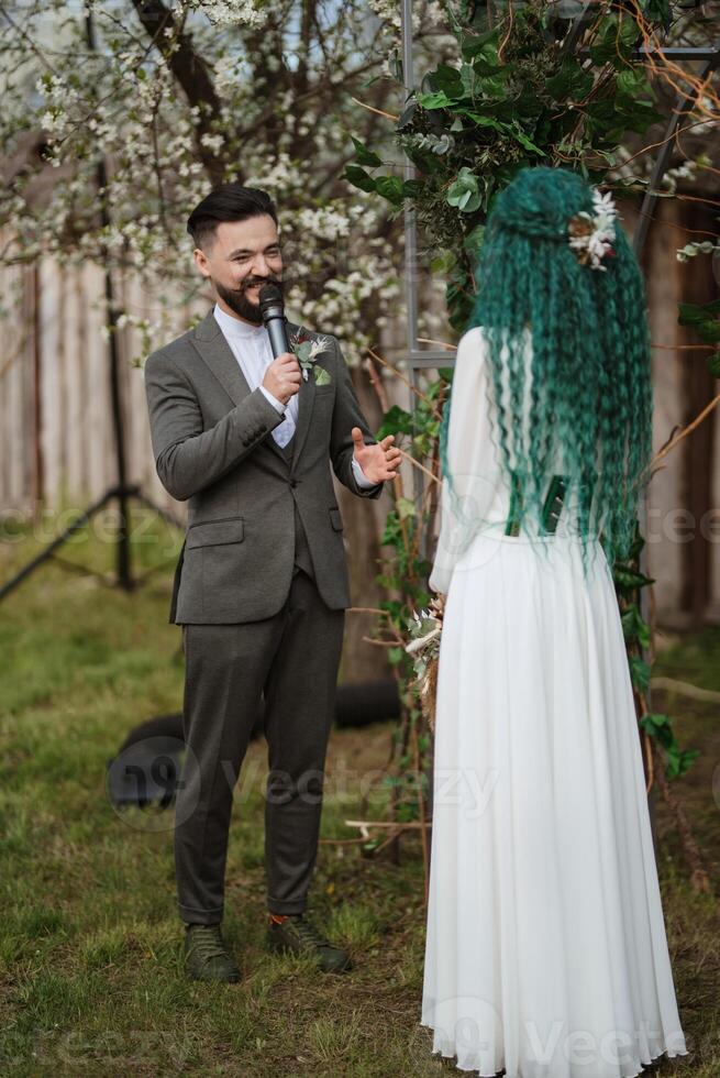 wedding ceremony of the newlyweds in a country cottage photo