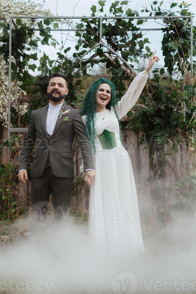 the first wedding dance of the bride and groom in the glade photo