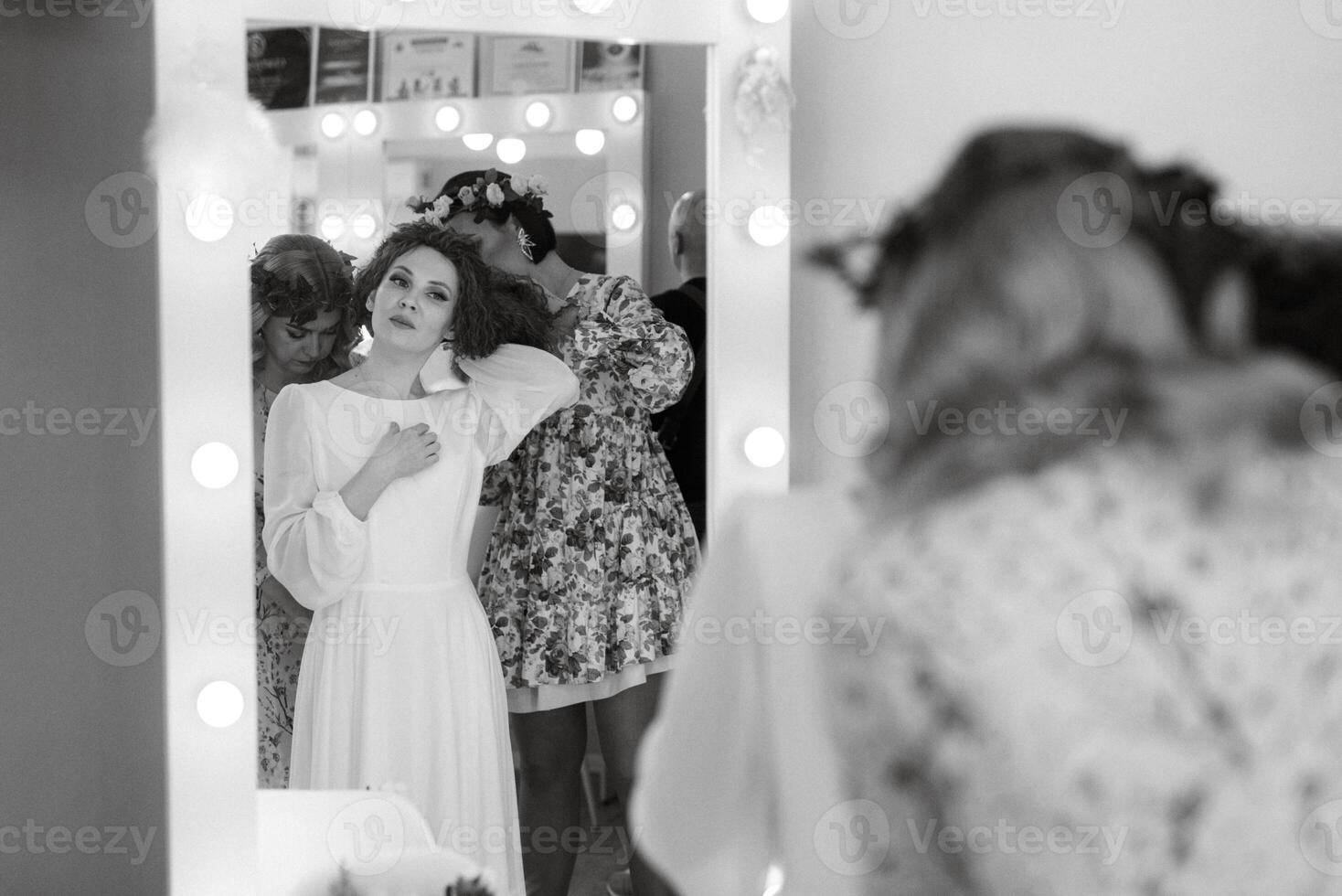 portrait of a bride with green curly hair in the beauty room photo