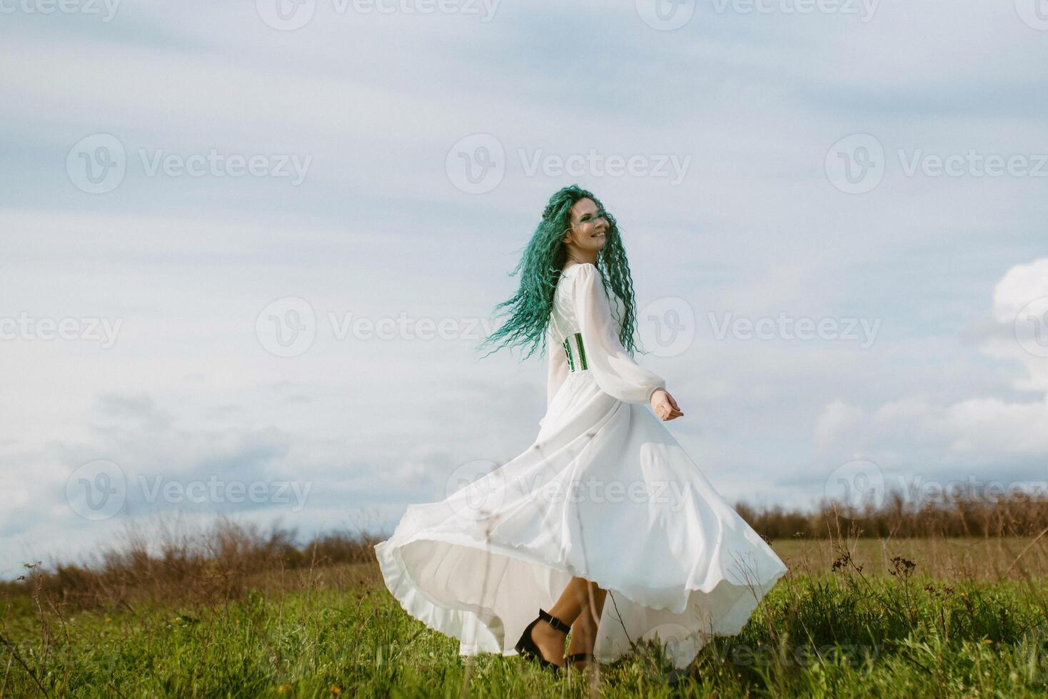 young girl bride with green hair in a national dress photo