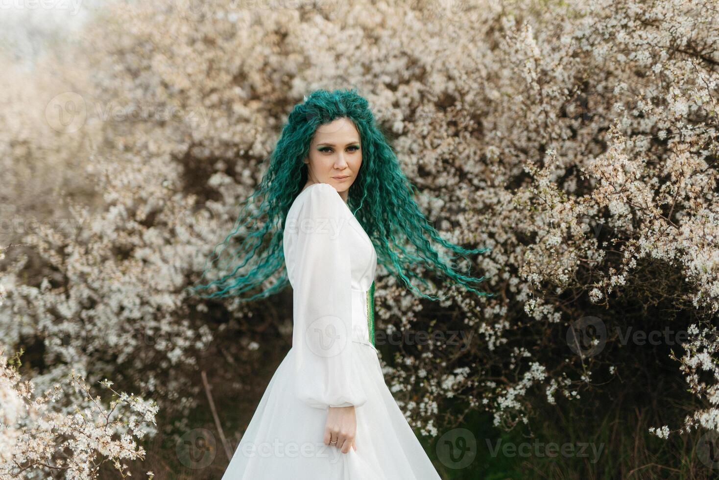 young girl bride with green hair in a national dress photo