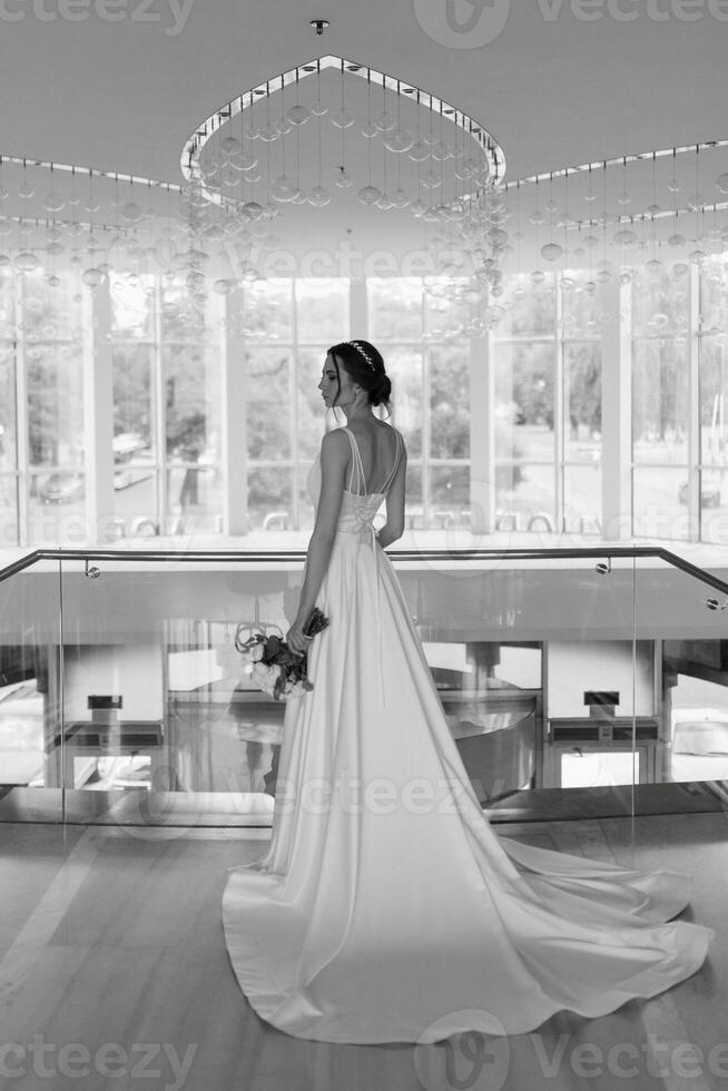 bride on the gold hotel stairs photo