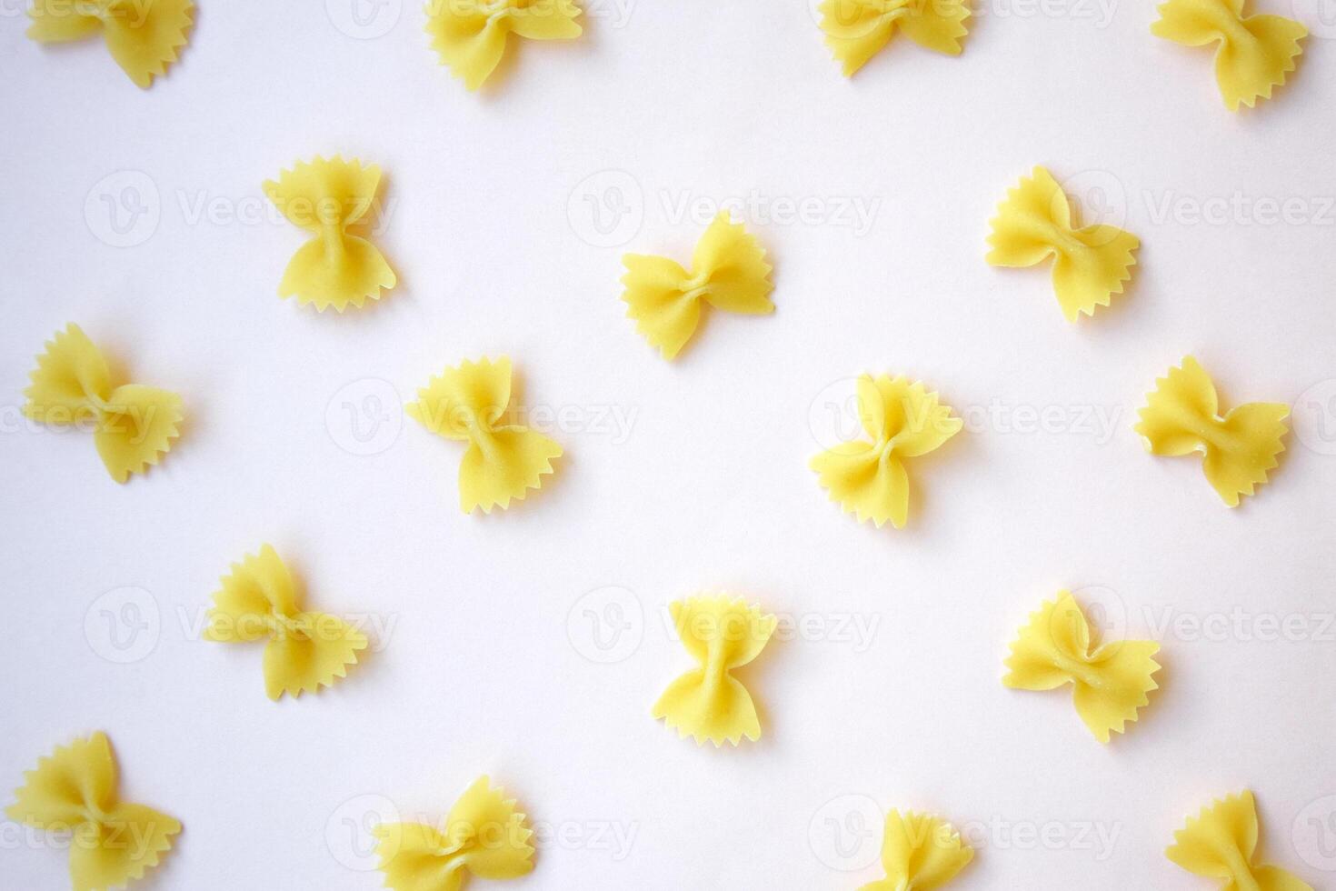 There are a lot of butterfly-shaped pasta on the table. photo