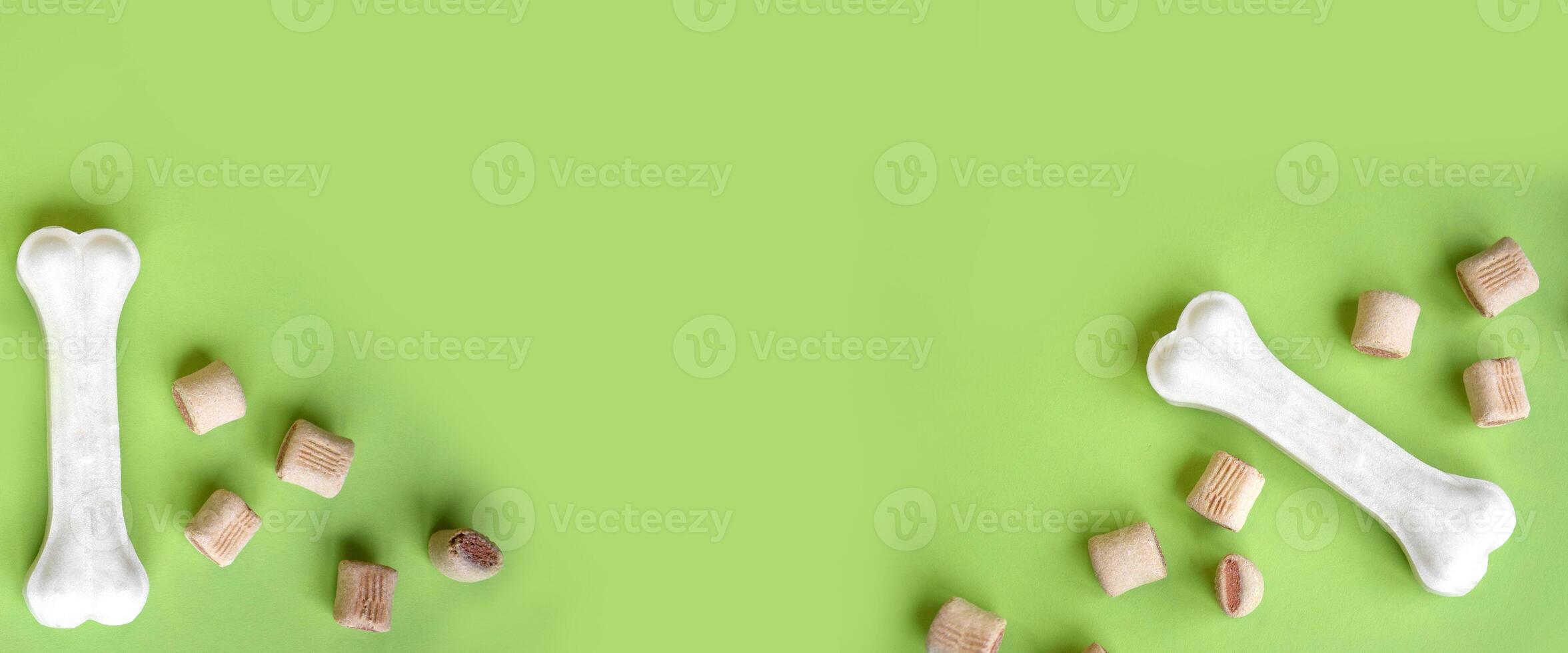 Treats for dogs on a light green background. photo