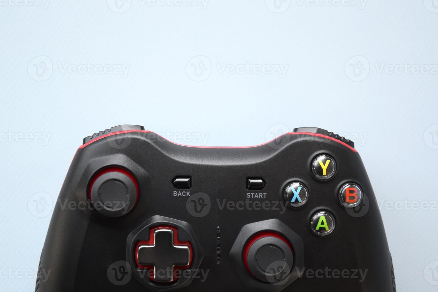 Two joystick gaming controller on light blue background. Minimalism. photo