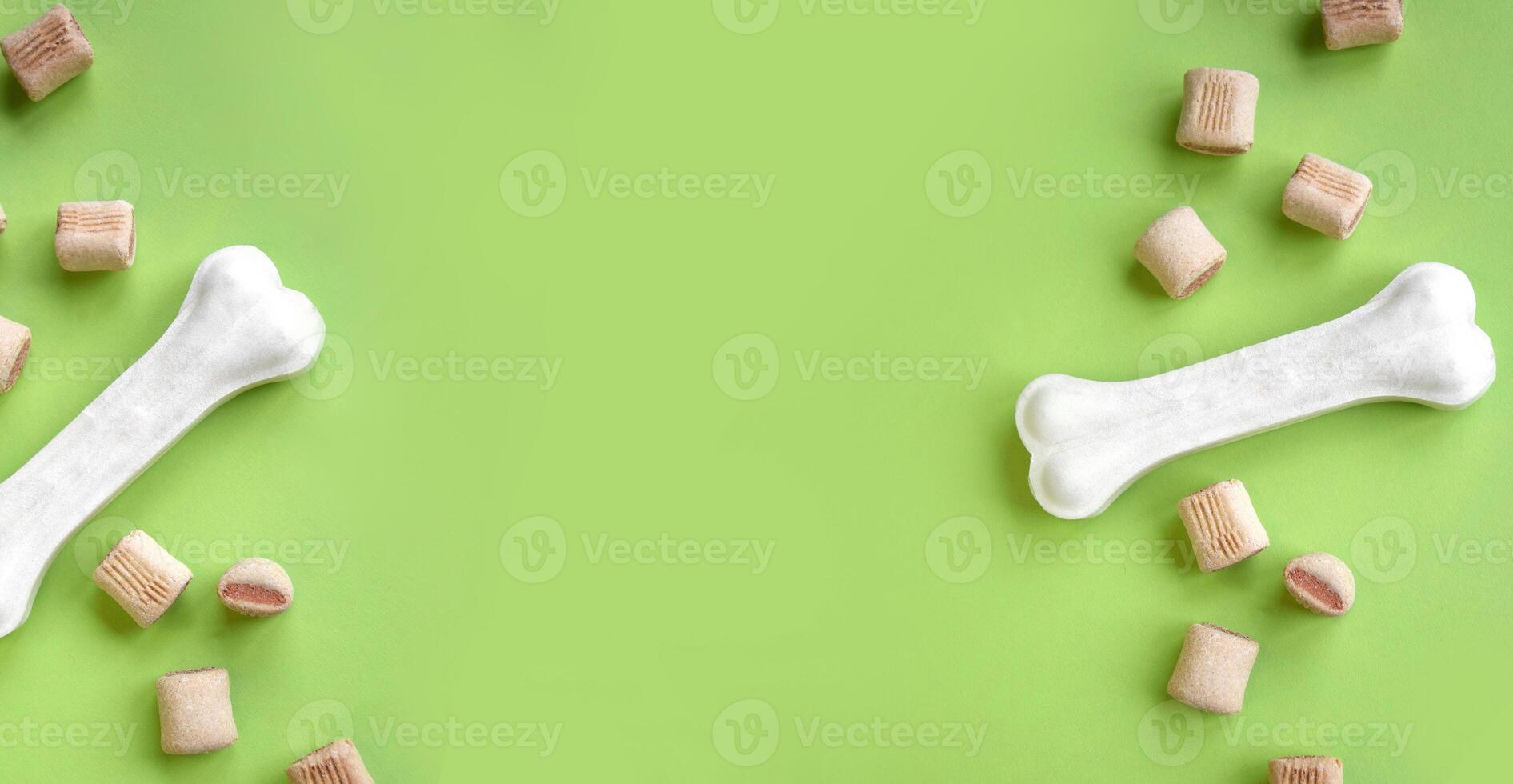 Treats for dogs on a light green background. photo
