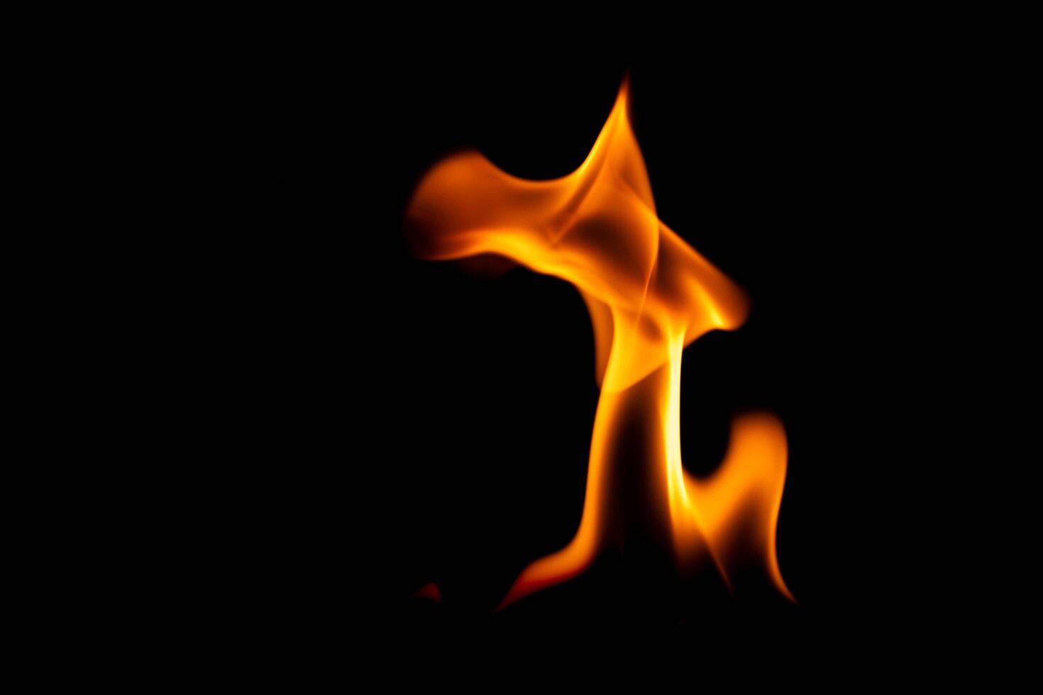 Hot flames on a black background. Beautiful flame of fire in the dark. Abstract of burning flames and smoke. photo