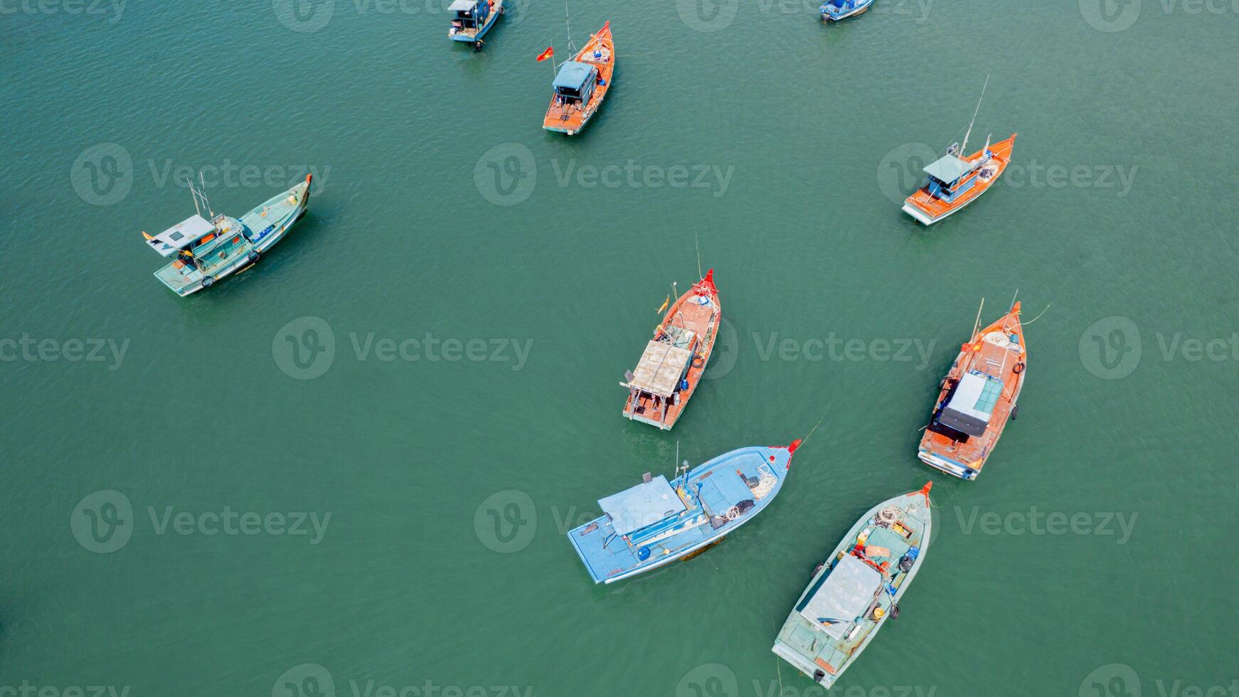 Colorful Fishing Fleet on Serene Waters photo