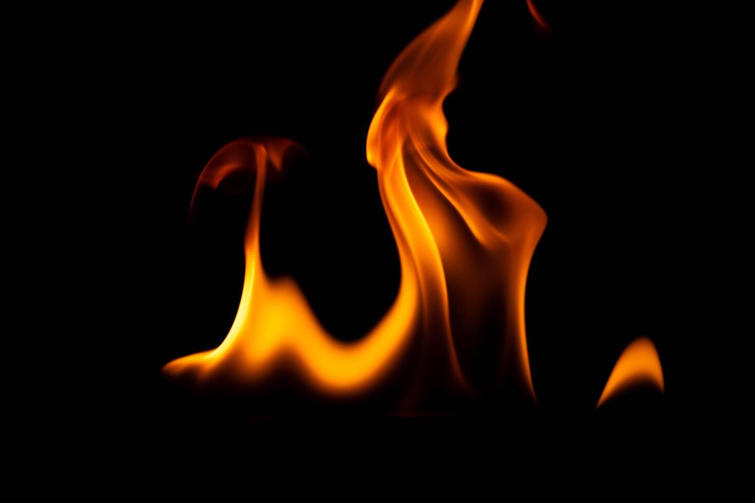 Hot flames on a black background. Beautiful flame of fire in the dark. Abstract of burning flames and smoke. photo