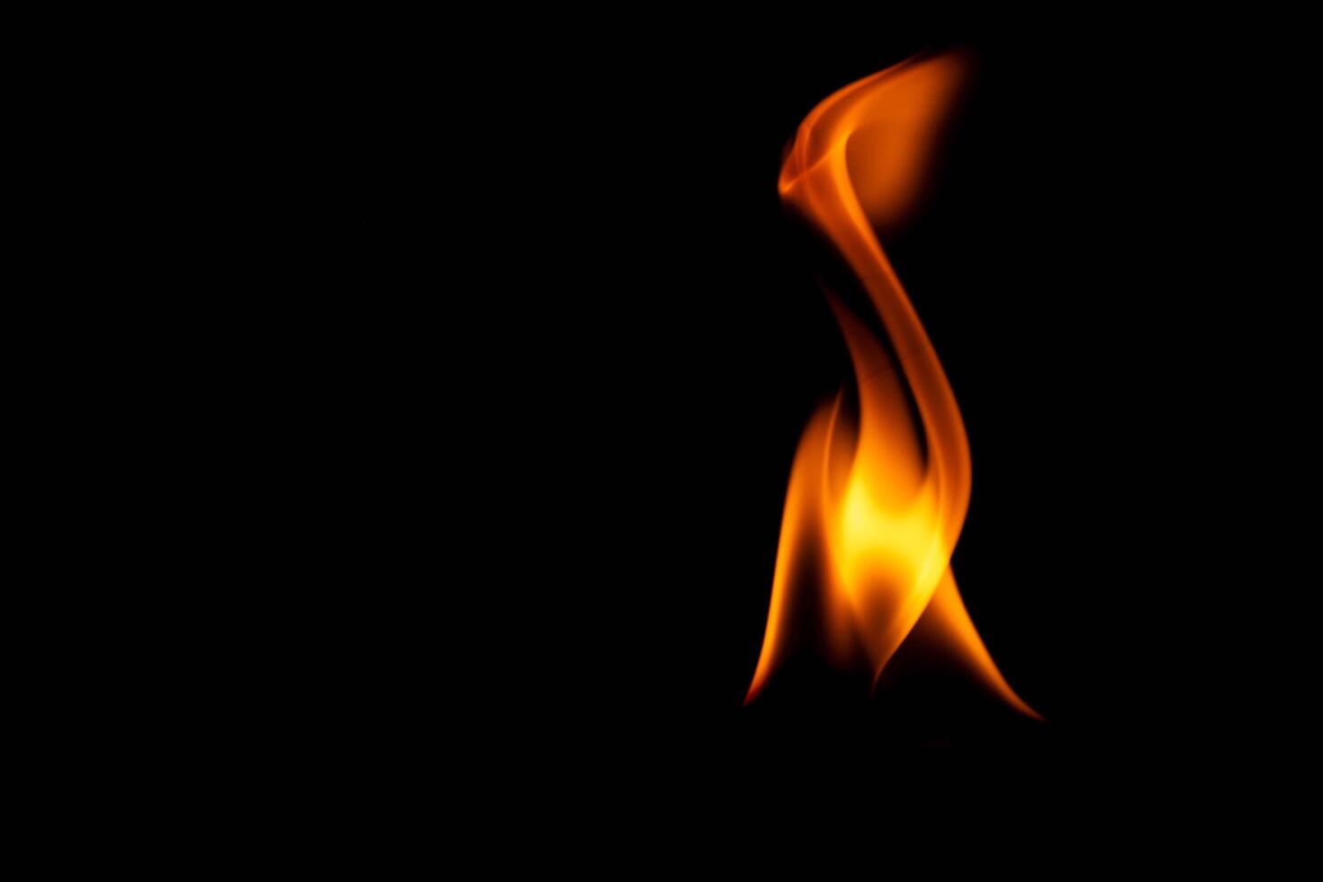 Hot flames on a black background. Beautiful flame of fire in the dark. Abstract of burning flames and smoke. photo